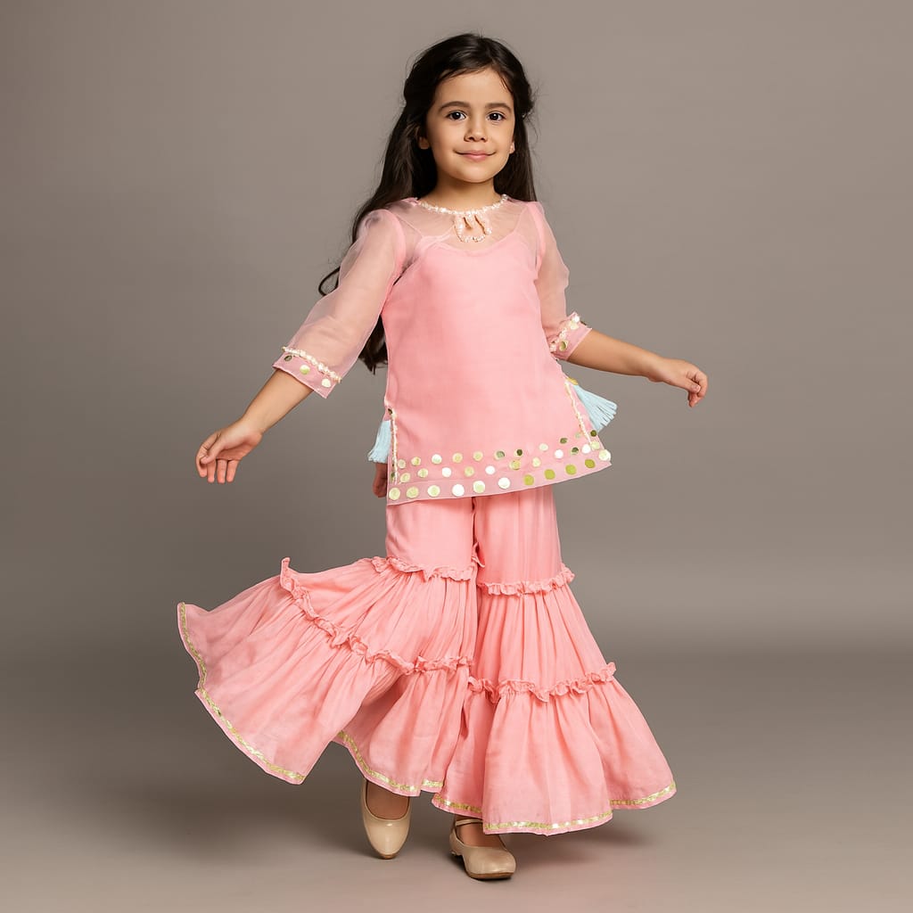 Pre Order: Elegant Strappy Top With Embellished Kurti And Ruffled Sharara With Dupatta