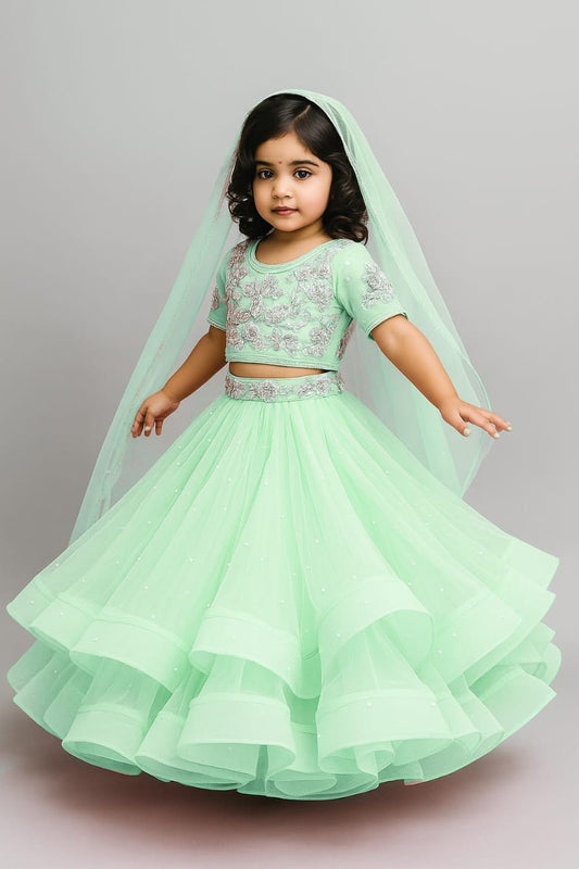 Pre Order:Pastel Green Embroidered Crop Top And Net Layered Lehenga