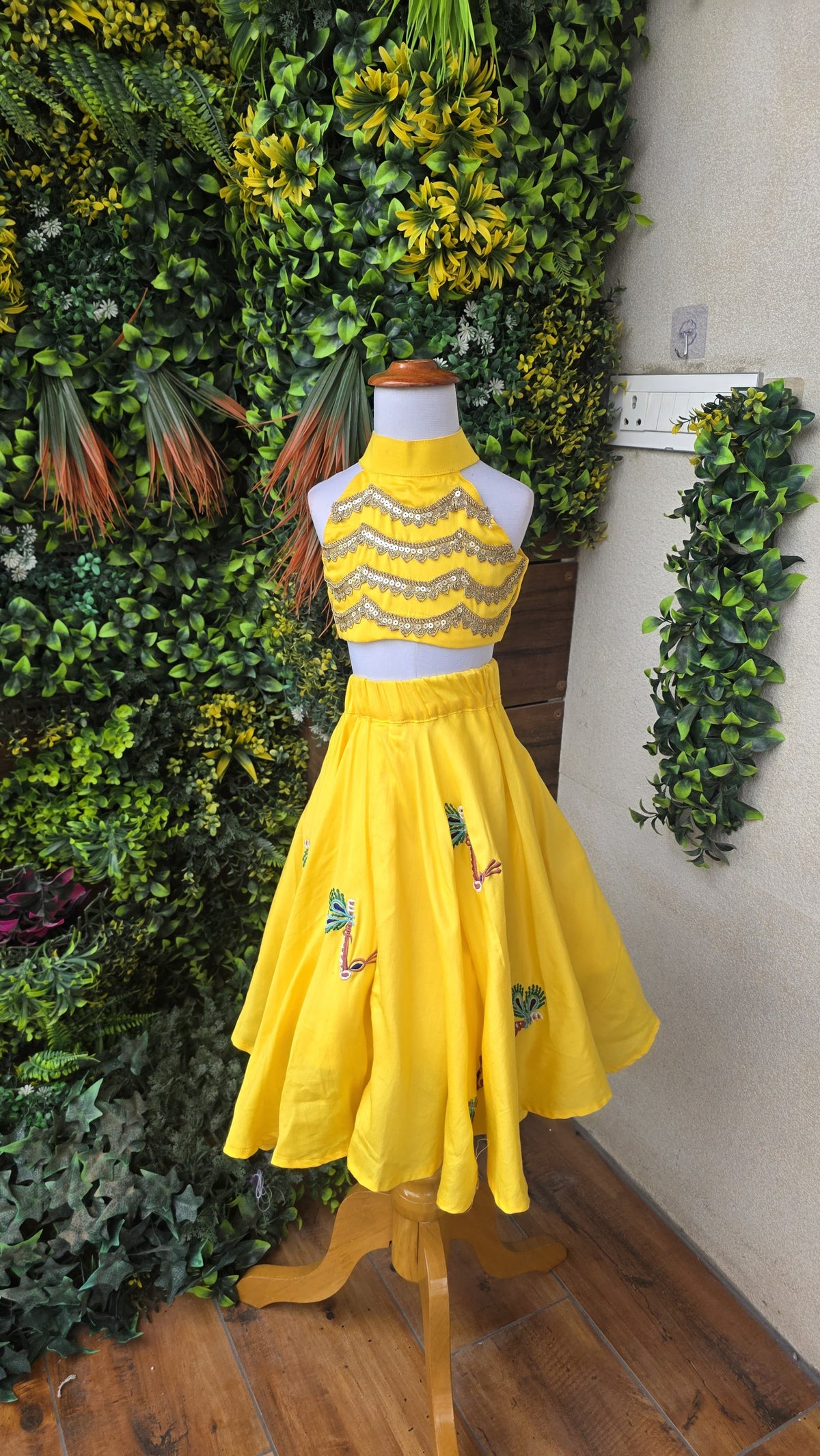 Pre Order: Yellow Embroidered Embellished Radha Halter Neck Top And Lehenga